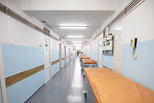 istock Long hospital corridor with gurneys without people. 1440752681