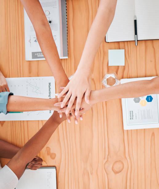 istock Team building, partnership hands and business people with support, trust and teamwork in company workshop. Collaboration, unity and diversity with employees with vision, mission and networking 1440752774