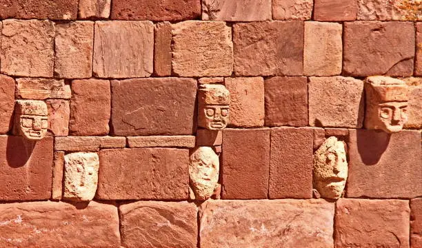 Heads in the Semi-Subterranean Temple at Tiwanaku  archaeological area, near La Paz, Bolivia. There is a great variety of heads and  are believed to represent the range of ethnicities or communities who were governed by the Tiwanakus.