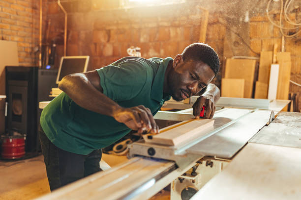 istock Carpenter Measuring a Wooden Plank 1440754281