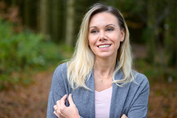 istock Woman with crossed arms in a forest 1440754630