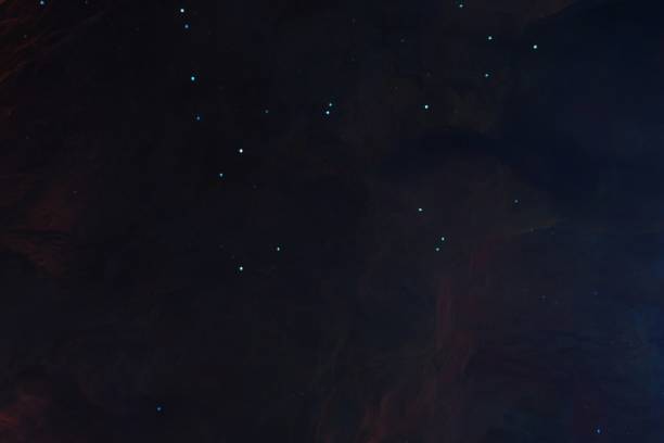 istock Computer drawn illustration of particles with a dark background 1440757091