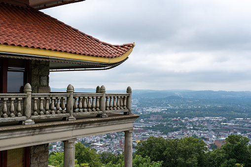 A building of a traditional pagoda style and the city of Reading in Pennsylvania in the background