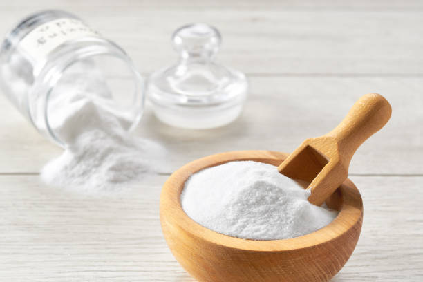 istock sodium bicarbonate on a white wooden table, close-up. 1440760028
