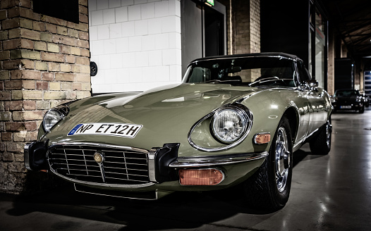 Berlin, Germany – November 24, 2020: BERLIN, GERMANY 24.11.2020. Nice green Jaguar oldtimer car, in a public exhibition in Berlin.