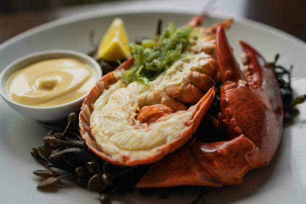 istock Selective focus shot of an appetizing lobster with a lemon slice and sauce 1440762382