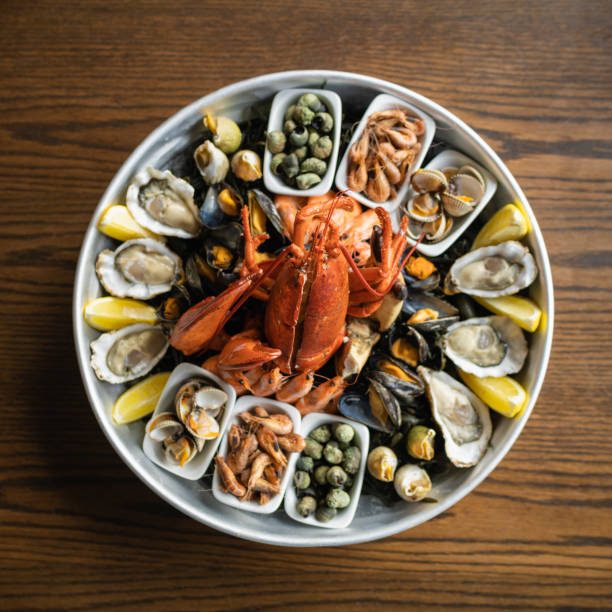 istock Top view of appetizing seafood mix on a wooden table 1440762512