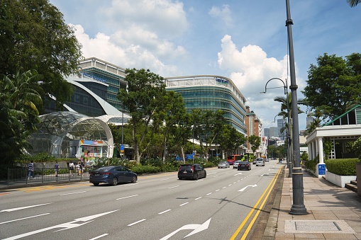Singapore, Singapore – October 15, 2022: Cars driving past in front of Plaza Singapura, before this section of Orchard Road becomes car-free in 2025.