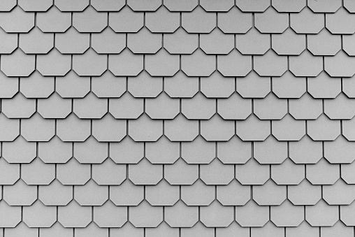 A fragment of gray octagon-shaped roof tiles