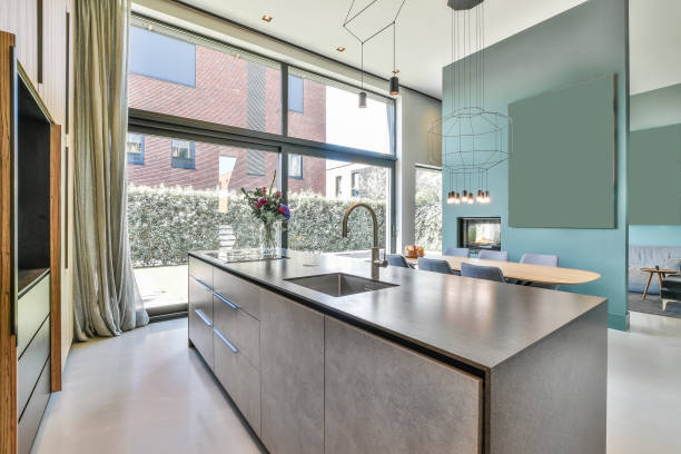 istock Kitchen of a modern apartment with big windows 1440764680