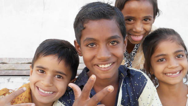 istock Group of Indian siblings smiling and looking at the camera 1440766942