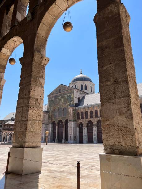 istock Ancient Umayyad Mosque from arch columns against the blue sky 1440767526
