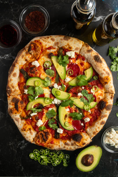 istock Top view shot of a fresh avocado pizza 1440768052