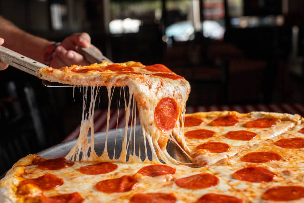 istock Shot of a fresh cheesy pizza 1440768393