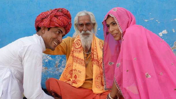 istock Religious ascetic Sadhu blessing young newlyweds 1440769065
