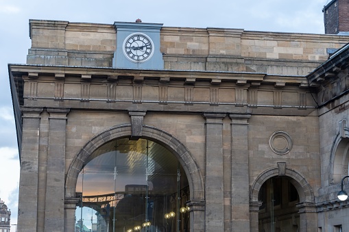 NEWCASTLE UPON TYNE, United Kingdom – November 03, 2022: Newcastle Central railway station entrance with clock and arches, in Newcastle upon Tyne, UK