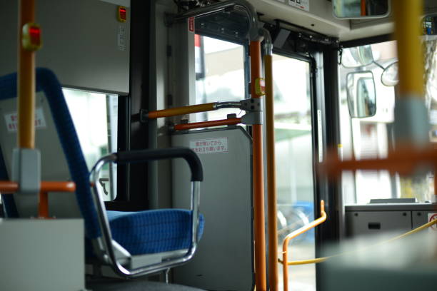 istock Inside of a city bus with empty passengers seats 1440770194
