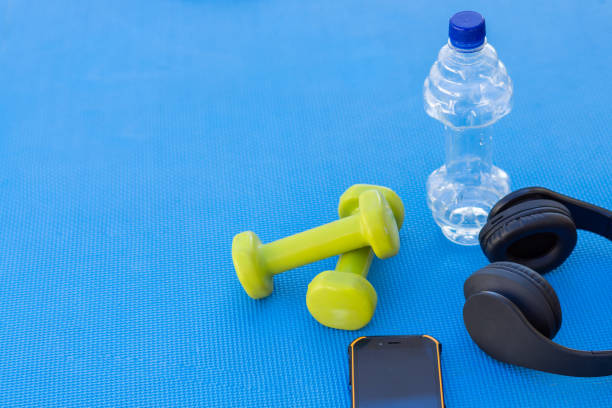 weights and fitness training equipment weights and fitness training equipment on the gym floor griff stock pictures, royalty-free photos & images