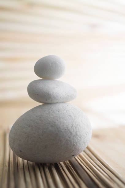 istock Vertical shot of white stones on a blurred background 1440770570