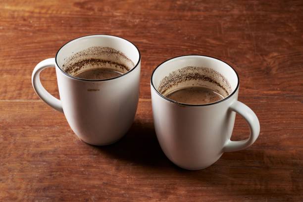 istock wo cups of brewed coffee milk 1440770784