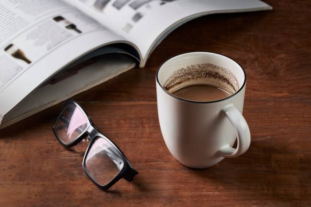 istock Coffee milk, glasses and magazine 1440770799