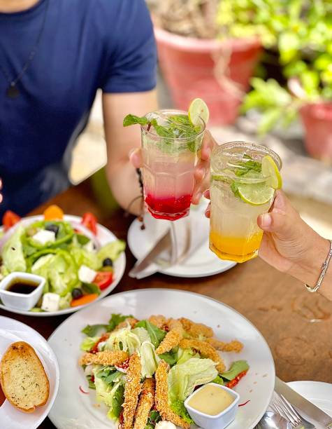 istock Vertical shot of a dinner table with various types of food 1440771728