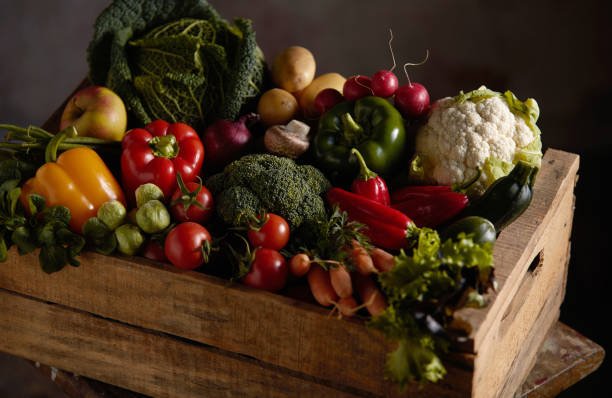 istock Wooden container with the harvest of various fresh vegetables, placed on the table 1440772090