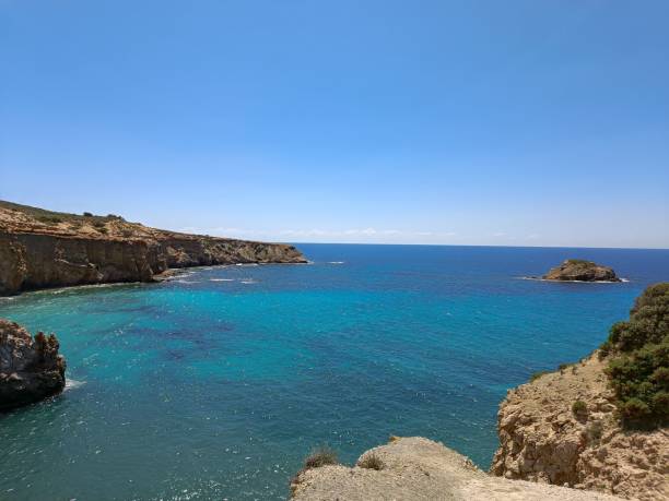 istock Sea surrounded by cliff formation on a sunny day in Greece 1440772756