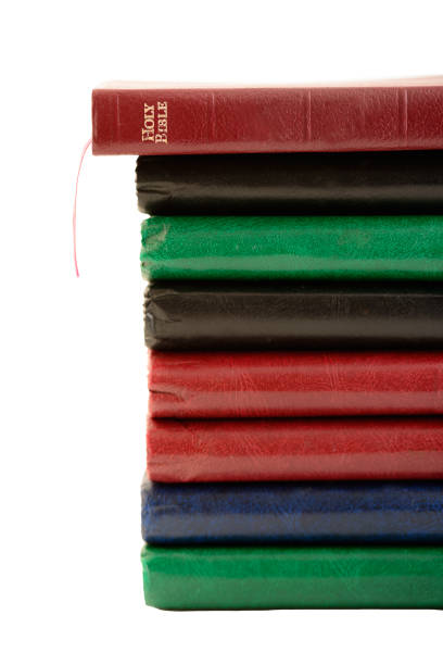 Bible on top of a stack of hardback books