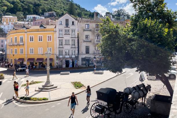 Tourists hanging out at Praca Da Republica in Sintra Sintra, Portugal – September 18, 2022: Tourists hanging out at Praca Da Republica caleche stock pictures, royalty-free photos & images