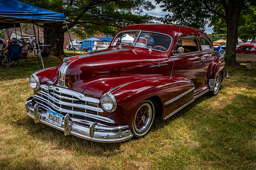 Des Moines, IA - July 02, 2022: High perspective front corner view of a 1948 Pontiac Torpedo 8 Silver Streak Coupe at a local car show.