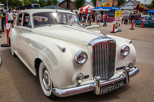 Des Moines, IA - July 02, 2022: High perspective front corner view of a 1957 Bentley S1 Standard Steel Saloon at a local car show.