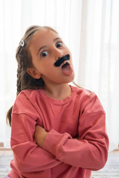 istock Mustached Little Girl 1440775349