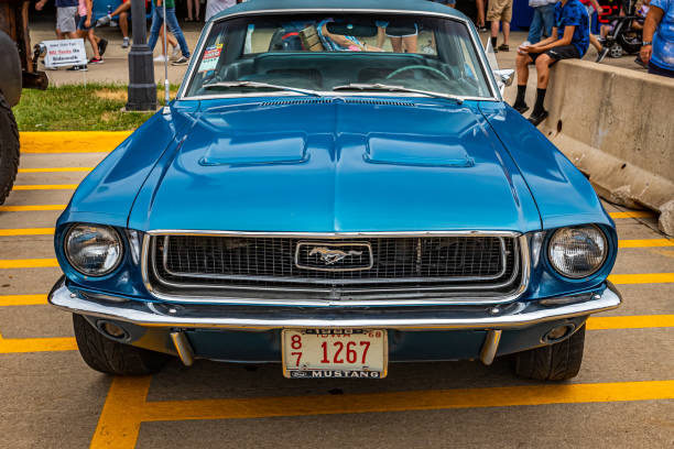 Des Moines, IA - July 02, 2022: High perspective front view of a 1968 Ford Mustang GT Hardtop Coupe at a local car show.