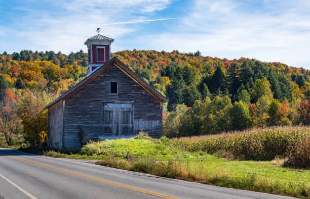 istock Wooden barn against Vermont fall colors on hillside 1440775676