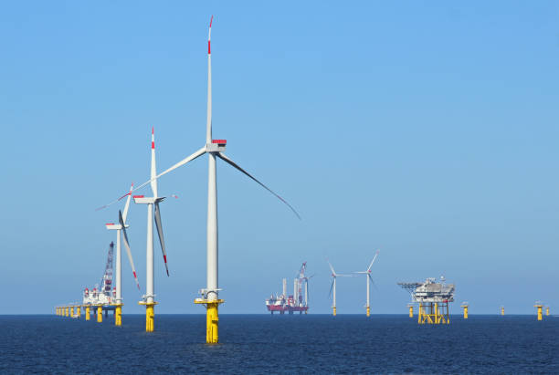 industrial stations, wind turbines, and fuel stations in the middle of the ocean - sea wind turbine turbine wind imagens e fotografias de stock