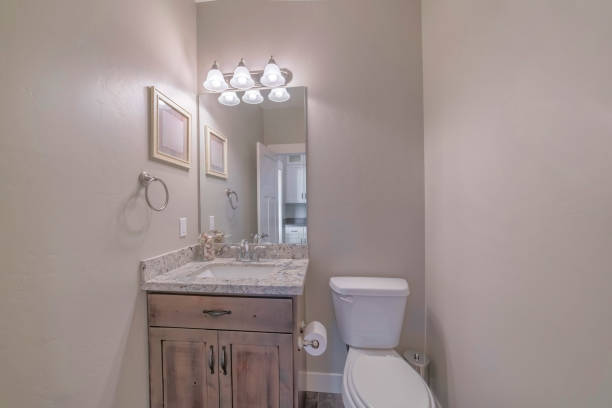istock Mirror, sink with cabinet, and faucet - modern and minimalistic bathroom interior 1440776697