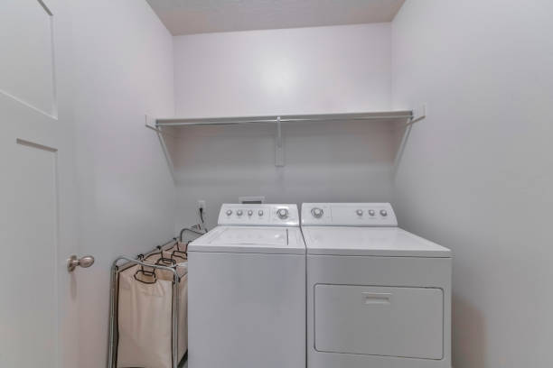 istock Laundry room with a washing machine and dryer for clothes 1440777456
