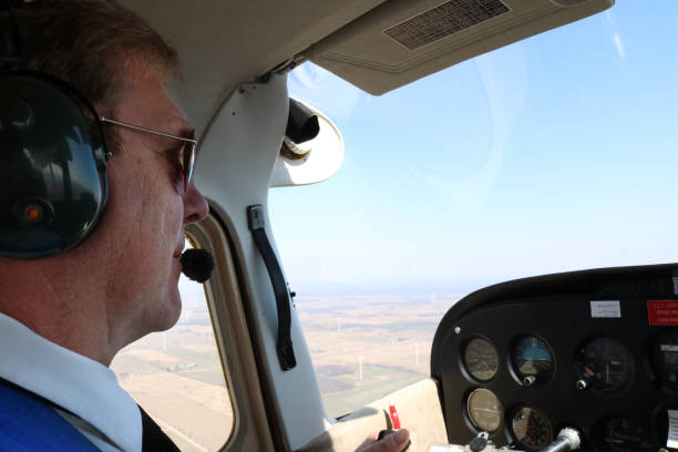 istock Cose-up of man flying an airplane 1440778348