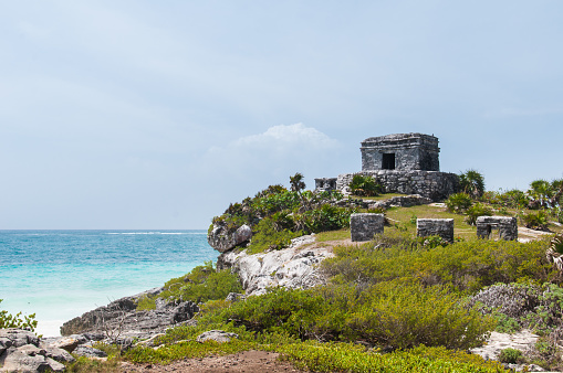 Tulum, Mexico – May 08, 2017: The God of Winds Temple at the coast of Caribbean sea. Ancient Mayan ruins in Tulum, Mexico