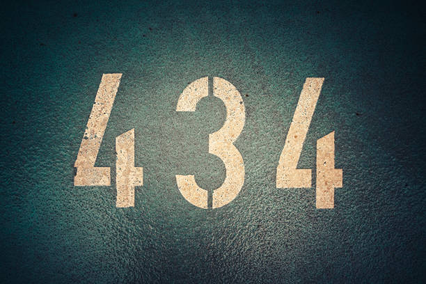 istock Closeup of white number 434 on a wall 1440779153