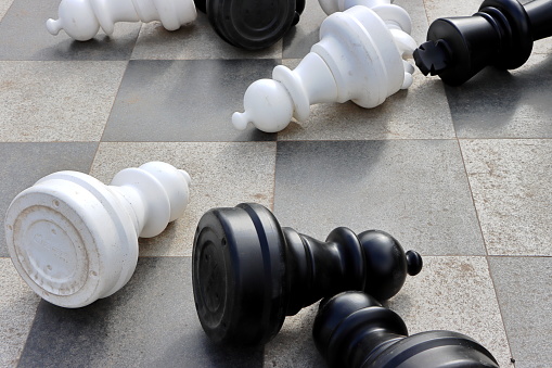 A top view of  scattered big chess pieces at Holland Park, London, UK