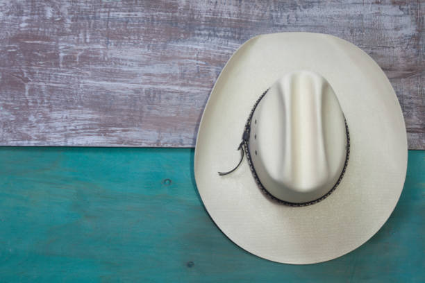 istock Top view of a white beach hat on two colored wooden background 1440779238