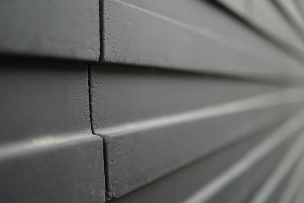 istock Vertical shot of grey gear wall panels 1440779721