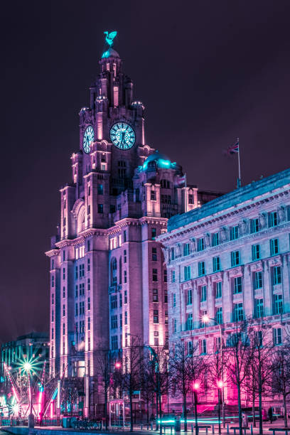 Liverpool Waterfront in purple. Liverpool waterfront illuminated in purple from an adjacent structure. liverpool england stock pictures, royalty-free photos & images