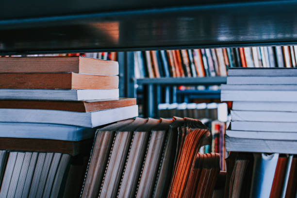 istock Stack of books on a shelf in the public library 1440781190