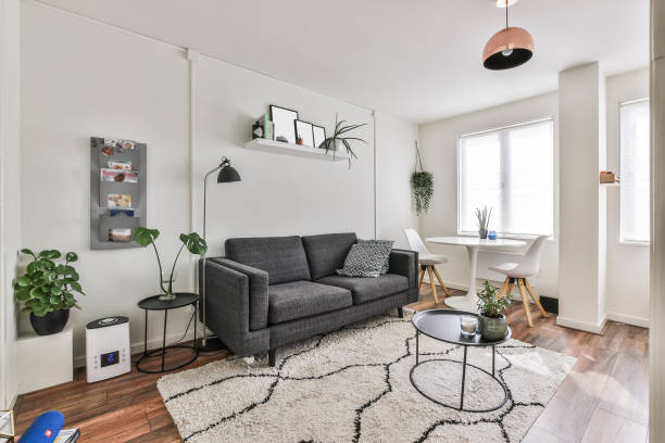 interior design and decoration of a modern living room with a dining table - apartment interior imagens e fotografias de stock