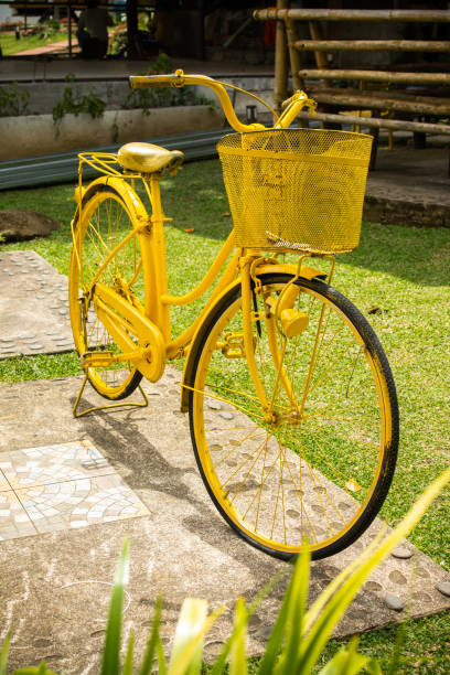 istock Vertical shot of a yellow bicycle with a basket 1440782223