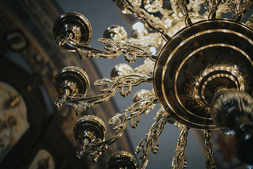 A closeup of a luxury chandelier inside a hall