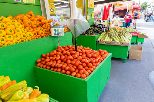 Queens, United States – July 26, 2021: A greengrocery with fresh fruits and vegetables in Astoria, Queens, New York
